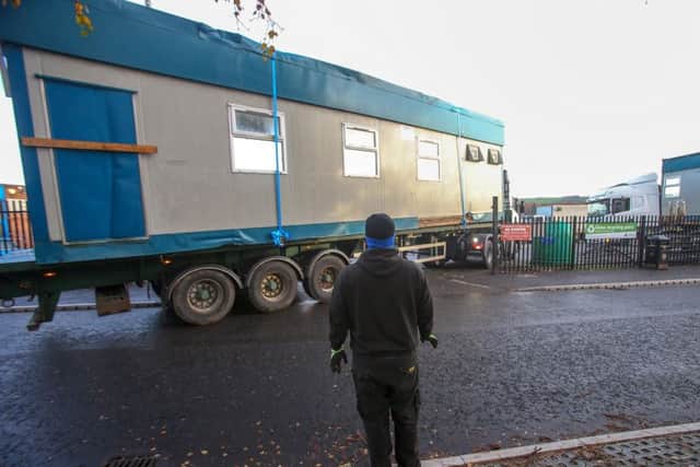 A portacabin-type building is removed from East Belfast FC by contractors in Inverary Avenue. 
Pic: Colm Lenaghan/ Pacemaker