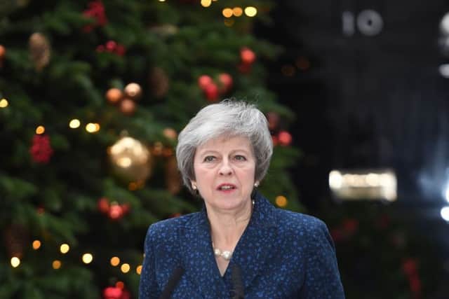 Prime Minister Theresa May makes a statement outside 10 Downing Street, London, on Wednesday