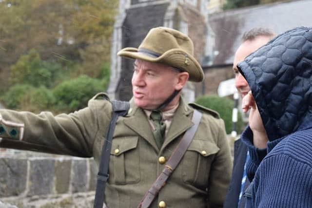 Kieran McCarthy, dressed in an Irish Volunteer uniform from 1916, working as a tour guide for Cobh Rebel Walking Tours.