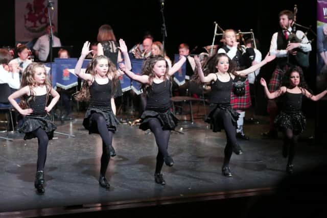 Irish dancers, musicians, actors and singers performing in Voices of Volunteers in NewtownabbeyÂ’s Theatre at the Mill