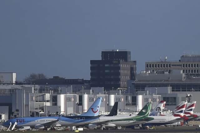 Grounded aircraft next to a terminal at Gatwick airport. Photo credit: Pete Summers/PA Wire