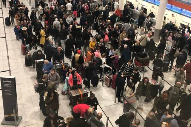 Queues of passengers in the check in area at Gatwick Airport this morning. Photo credit: Thomas Hornall/PA Wire