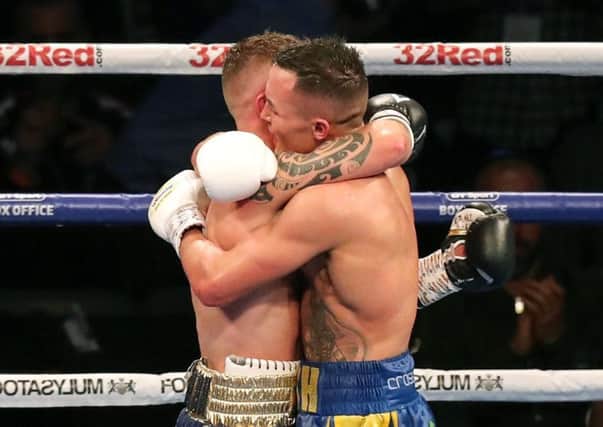 Carl Frampton and Josh Warrington embrace after their fight on Saturday night. Pic by INPHO.