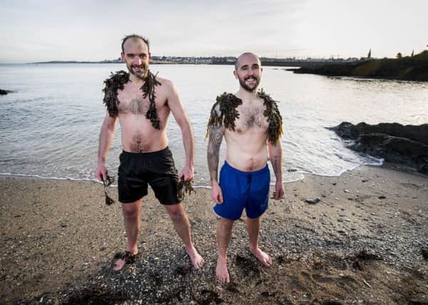 Andrew Bree (left) with Scott Riley at the beach in Bangor