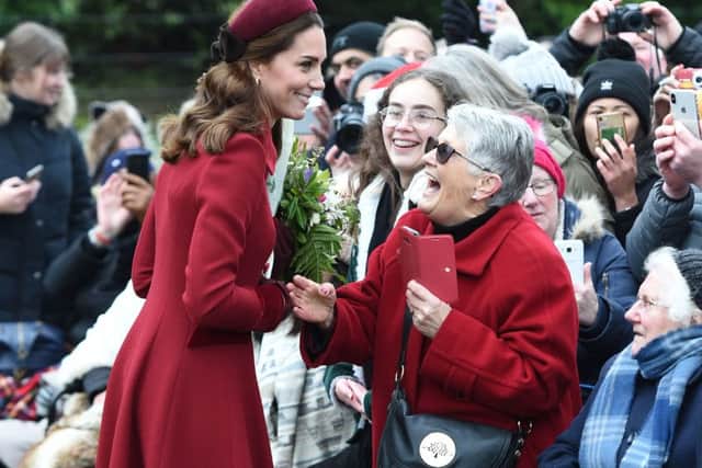 The Duchess of Cambridge speaks with Jill Lee, 71, from Cambridge as she arrives to attend the Christmas Day morning church service at St Mary Magdalene Church in Sandringham, Norfolk. Photo: Joe Giddens/PA Wire