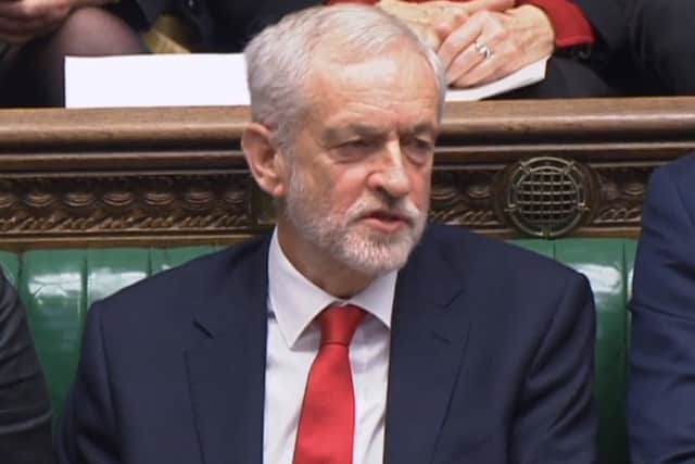 Labour leader Jeremy Corbyn says something under his breath after the Prime Minister likened Labour's attempt to table a no confidence motion in her to a pantomime, during Prime Minister's Questions in the House of Commons, London on Wednesday December 19. Mr Corbyn denied mouthing "stupid woman" at Theresa May. Photo: House of Commons/PA Wire