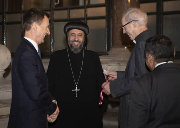 Foreign Secretary Jeremy Hunt (left), The Archbishop of Canterbury Justin Welby (right) with Archbishop Angaelos of the Coptic Orthodox Church of Britain at a meeting at the Foreign Office in central London. Photo: Jones/PA Wire