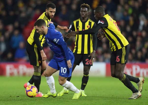Chelsea midfielder Eden Hazard takes on the Watford defence
