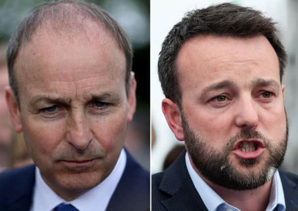 File photos of Fianna Fail leader Micheal Martin (left) and SDLP leader Colum Eastwood. Mr Martin said in April that talks of a Fianna Fail merger with the Social Democratic and Labour Party (SDLP) to contest elections in Northern Ireland are a work in progress.