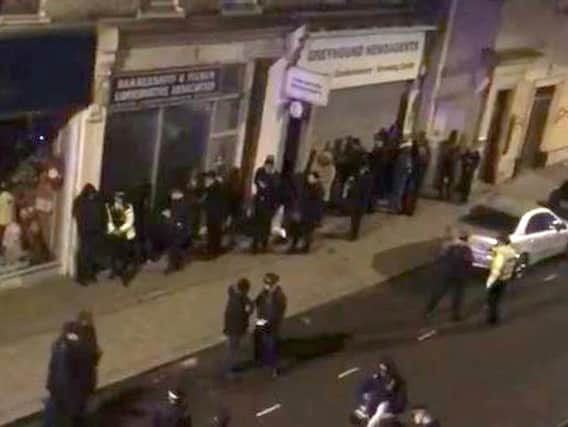 Still taken from video issued by an unnamed source of the scene at a property in Greyhound Road in Hammersmith, west London where thirty-nine people were arrested on suspicion of attempted murder following a incident in Fulham Palace Road. (Photo: P.A. Wire)