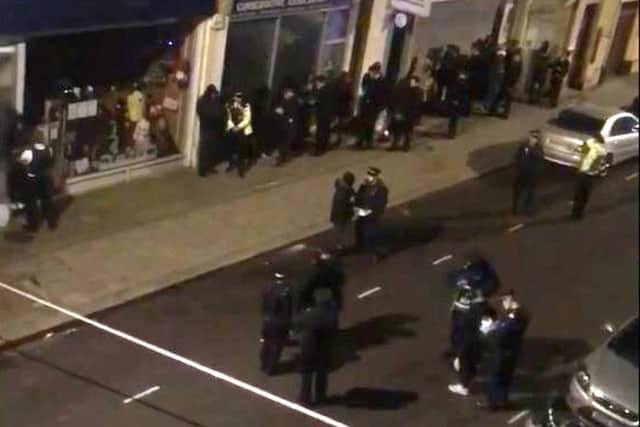 Still taken from video issued by an unnamed source of the scene at a property in Greyhound Road in Hammersmith, west London where thirty-nine people were arrested on suspicion of attempted murder following a incident in Fulham Palace Road. (Photo: P.A. Wire)
