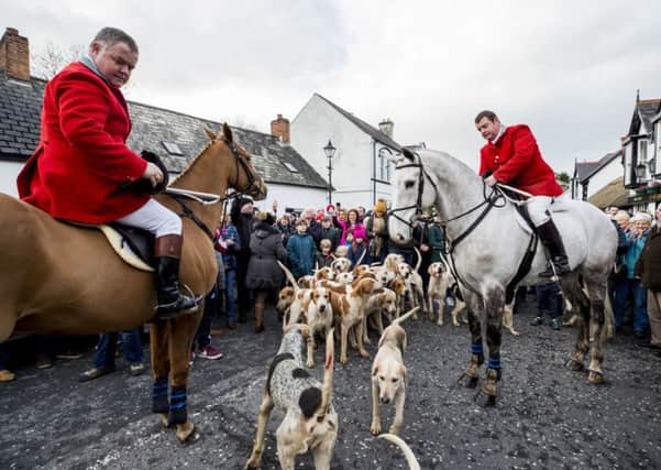 The Field Master (left) and Huntsman Master of the hunt prepare to start the North Down New Year Hunt in Crawfordsburn, Northern Ireland. Photo credit: Liam McBurney/PA Wire