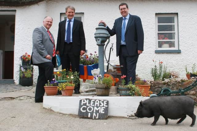 The then shadow secretary of state Owen Patterson (centre) with the DUPs David Simpson and Stephen Moutray outside Dan Winters Cottage in 2008