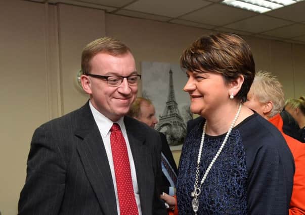 DUP MLA Christopher Stalford welcoming his party leader Arlene Foster to the opening of his new constituency office. Photo: Pacemaker