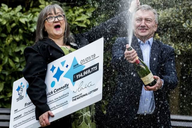 Champagne moment: Moira couple Frances and Patrick Connolly celebrate their Â£115 million EuroMillions jackpot win. Pic by Liam McBurney/PA Wire