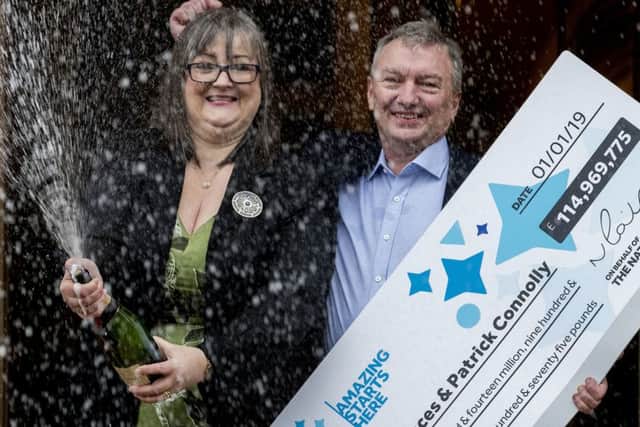 Frances and Patrick Connolly celebrate their Â£115m EuroMillions win at a press conference on Friday