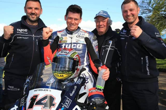 Manx rider Dan Kneen came out on top in a thrilling feature race at the Tandragee 100 on the Tyco BMW.