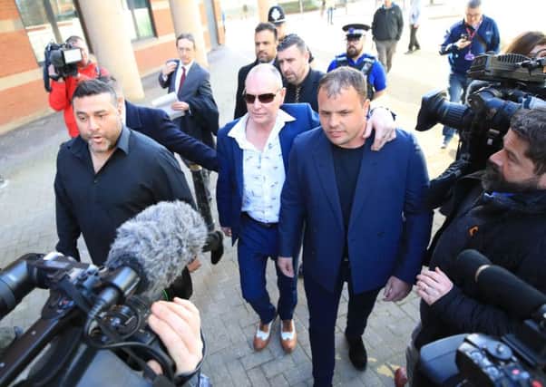 Former England footballer Paul Gascoigne (centre) leaves Teesside Crown Court in Middlesbrough where he was charged with sexually assaulting a woman on a train. Pic by Owen Humphreys/PA Wire