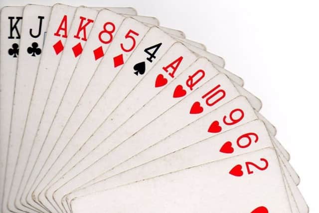 Each player is dealt 13 cards from the deck of 52