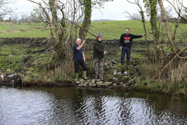 News Letters Graeme Cousins (centre) joins Nigel Cree (left) and Robert Maxwell (right) at the location of the planned fishing retreat. Picture by Arthur Allison Pacemaker
