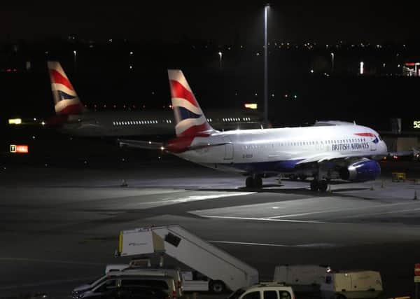 Planes at Terminal 5 at Heathrow airport after departures were temporarily suspended following "reports of drones" at the airport.  Photo: Yui Mok/PA Wire