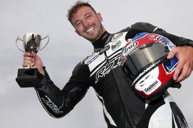 Magherafelt man Paul Jordan celebrates his victory in the Supersport race at Armoy.