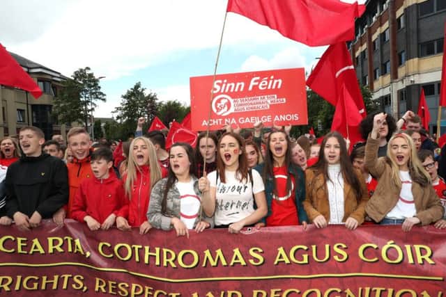 Irish language protestors dressed in red during an event in 2017. Belfast City Hall will be lit in red tomorrow