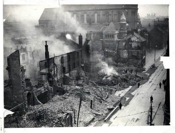 Blitzed buildings on lower Donegall Street, still smouldering on May 8 after the raid on 4/5 May