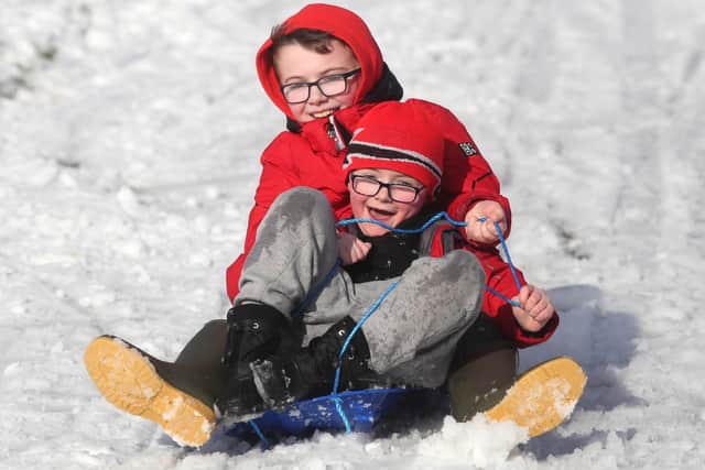 Northern Ireland children playing in the snow. (Photo: Lorcan Doherty Photography)