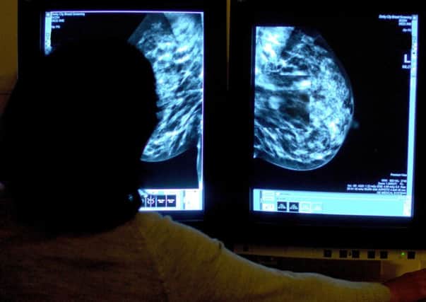 A consultant views mammogram results. Cancer waiting times published last week in NI were the worst on record
