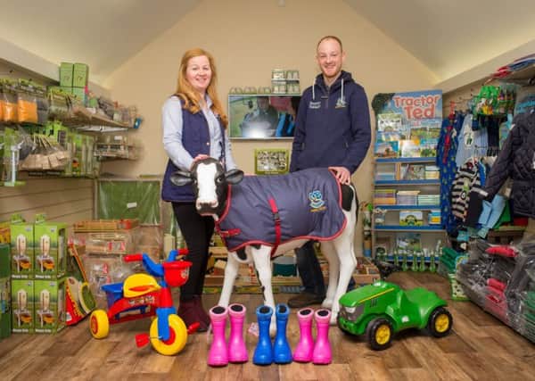Owner Jamie Beattie with office manager Jill McGeown display some of the toys available at the rural business