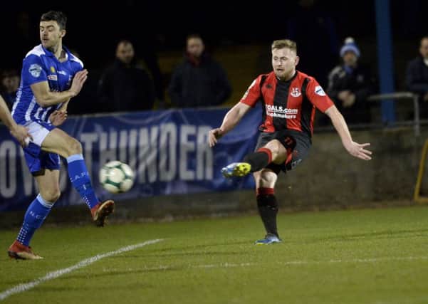 Crusaders David Cushley puts his side 1-0 up against Newry City