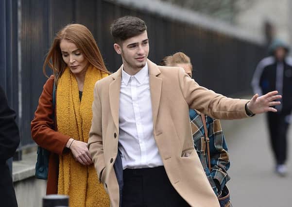 Jay Donnelly (brown/camel coat) pictured outside Belfast Magistrates' Court on January 3.  Picture: Arthur Allison/Pacemaker Press