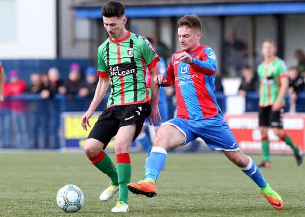 Glentoran's Eoghan McCawl
 (right) has joined Ards
