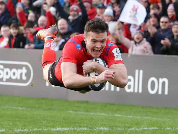 Jacob Stockdale scores on of his two tries against Racing in Belfast
