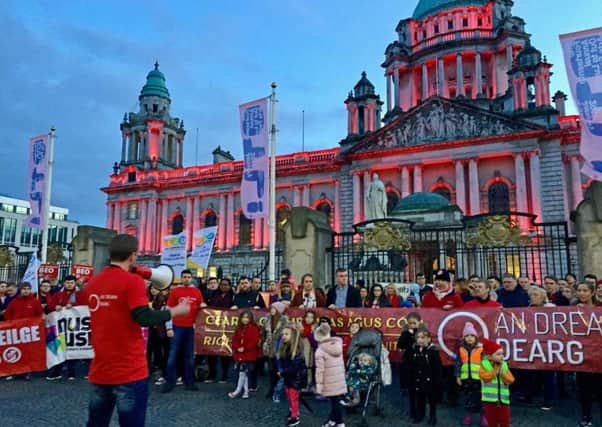 Belfast City Hall is lit up in red lights in support of those campaigning for an Irish Language Act in Northern Ireland. Pic by David Young/PA Wire