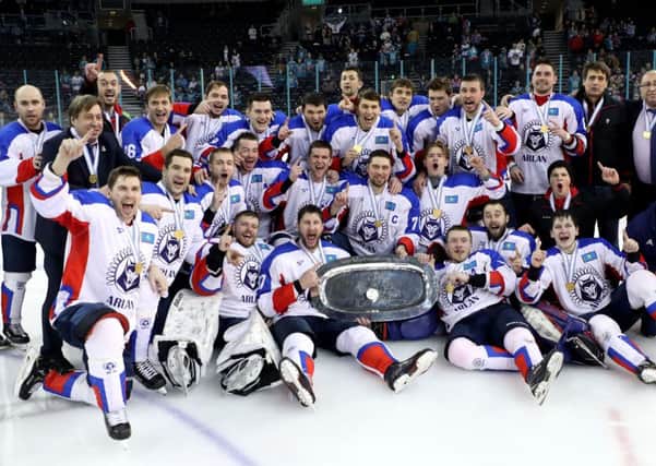 Arlan Kokshetau players celebrate winning the IIHF Continental Cup