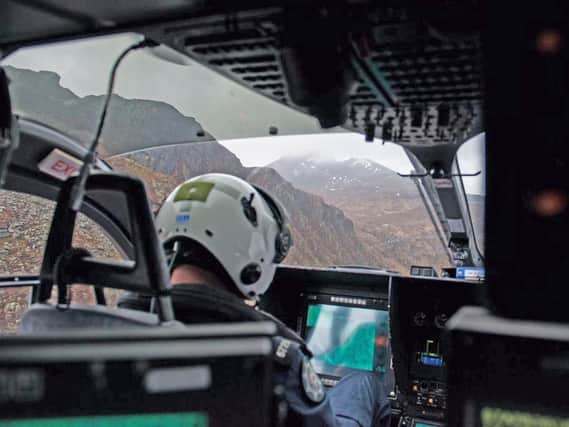 Handout photo taken from the Twitter page of @PSNIAirSupport of a support aircraft in the Mourne Mountains in Northern Ireland after two men died in separate falls.