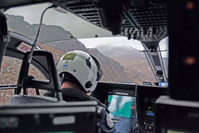 Handout photo taken from the Twitter page of @PSNIAirSupport of a support aircraft in the Mourne Mountains in Northern Ireland after two men died in separate falls.