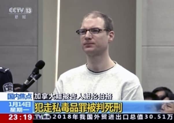 In this image taken from a video footage run by China's CCTV, Canadian Robert Lloyd Schellenberg attends his retrial at the Dalian Intermediate People's Court in Dalian, northeastern China's Liaoning province on Monday, Jan. 14, 2019. A Chinese court sentenced the Canadian man to death Monday in a sudden retrial in a drug smuggling case that is likely to escalate tensions between the countries over the arrest of a top Chinese technology executive. (CCTV via AP)