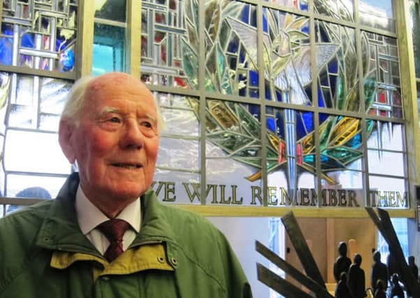 Cecil Rutledge, by a remembrance stained glass window in the Belfast War Memorial