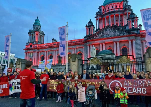 Belfast City Hall is lit up in red lights in support of those campaigning for an Irish Language Act in Northern Ireland, on January 12, 2019. Photo: David Young/PA Wire