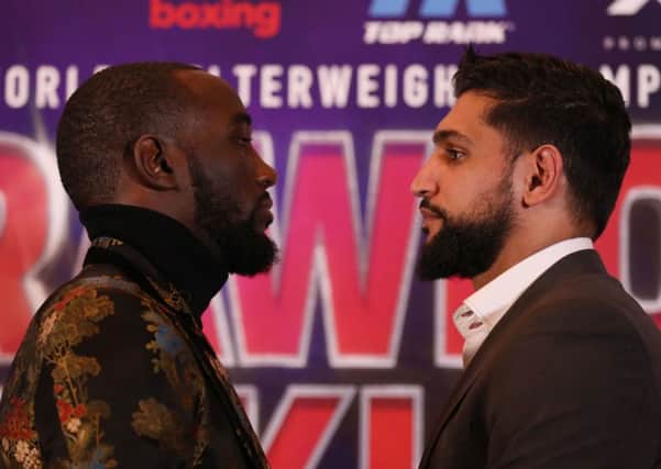 Terence Crawford (left) and Amir Khan during the press conference at The Landmark London Hotel