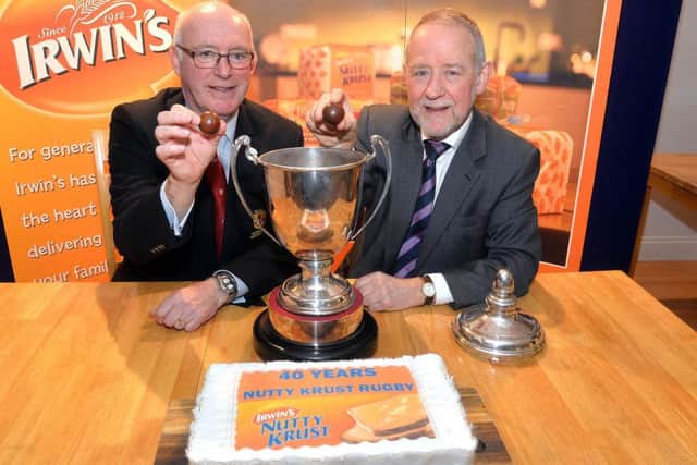 Stephen Elliott and Brian Irwin make the draw for the Nutty Krust Floodlit Cup 2019