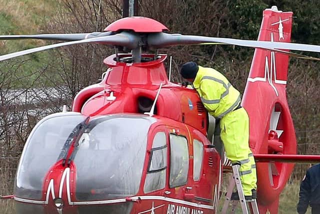 An engineer working to fix a fault on the air ambulance. Pic: Steven McAuley/McAuley Multimedia