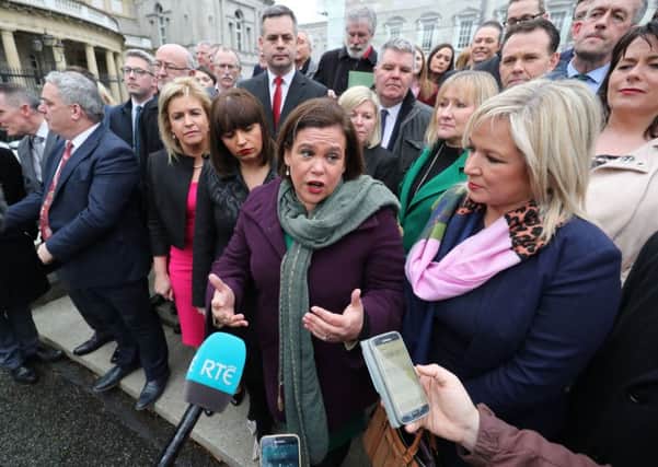 Sinn Fein Leader Mary Lou McDonald (centre) speaking to the media outside Leinster House in Dublin before the  centenary commemoration taking place to mark the inaugural public meeting of Dail Eireann in 1919.  Ms McDonald at the weekend "celebrated" the republican killing of two policemen in 1919 that sparked independence war. Photo: Niall Carson/PA Wire