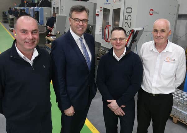 Invest NI CEO Alastair Hamilton, second left at the new Boyce Precision Engineering facility with, from left, BPE director Brian Boyce, ADS director Lesley Orr, BPE operations manager Brian Perry and director George Boyce
