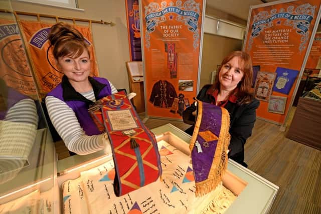 Museum of Orange Heritage staff Coleen Large (left) and Helen Johnston, showcase some of the artefacts at the new Through the Eye of a Needle exhibition