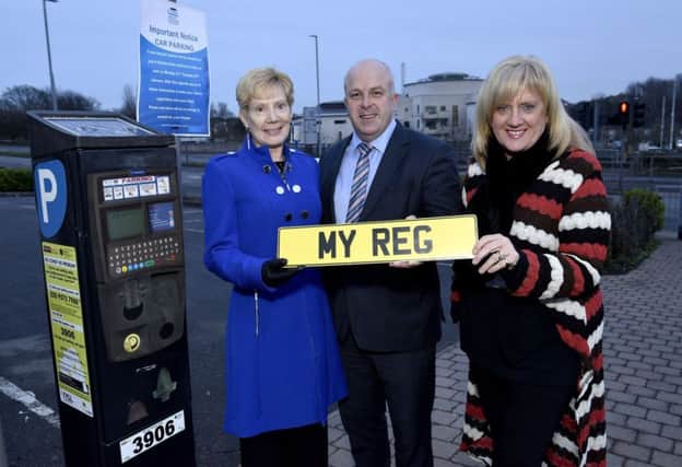 The picture issued on Friday of the chairman of Lisburn & Castlereagh City Council's Environmental Services Committee, Councillor Janet Gray MBE; vice-chairman Alderman James Tinsley and director of environmental services Heather Moore introducing the new updated ticketing system for the council's off-street pay and display car parks. The picture, which the council has insisted was 'for illustrative purposes only', was later recalled after the roll-out of the proposed scheme was suspended.