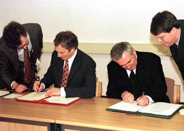 The then prime minister, Tony Blair, and his Irish counterpart, Bertie Ahern, sign the Belfast Agreement in April 1998. Mr Ahern saw the need for a late compromise on the Irish position to secure the deal, Lord Bew says. Photo: Dan Chung/PA Wire